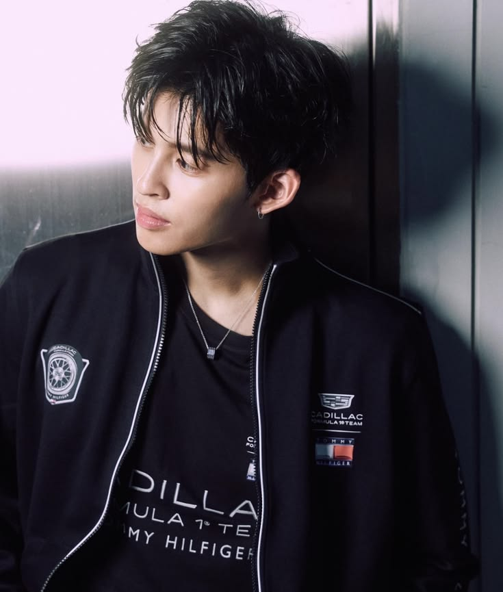 Pond Naravit in a black Cadillac Formula 1 Team x Tommy Hilfiger zip jacket